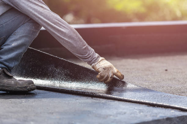 Professional Basement Waterproofing technician working in Patricksburg, IN